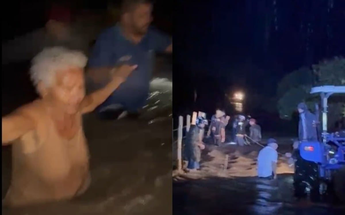 Enxurrada arrasta ambulância, e moradores fazem corrente humana para resgatar ocupantes