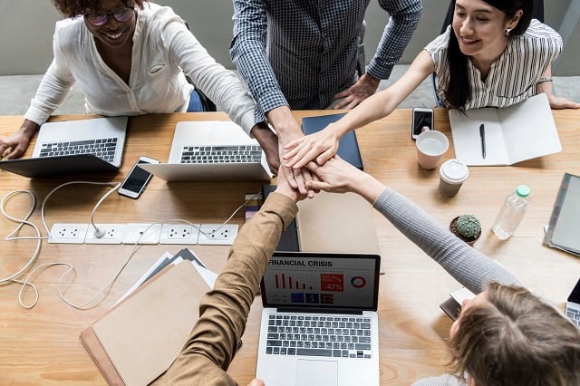 team-business-people-stacking-hands-1-640