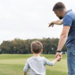 father-son-holding-hands-from-shot